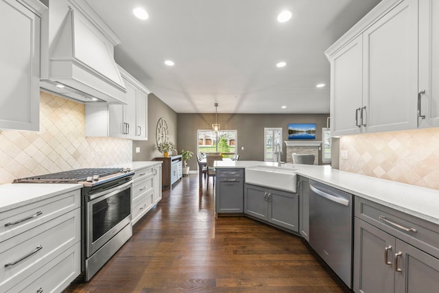 633 Bourbon Ct, Naperville, IL 60565 - kitchen featuring a sink, tasteful backsplash, custom exhaust hood, gray cabinetry, and appliances with stainless steel finishes