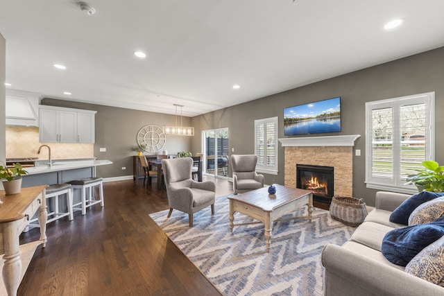 633 Bourbon Ct, Naperville, IL 60565 - living room featuring a fireplace, a wealth of natural light, dark wood-style flooring, and recessed lighting