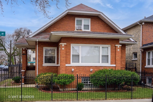bungalow-style home with a front lawn, brick siding, and fence private yard