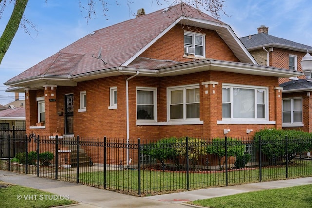 view of property exterior featuring brick siding, a yard, and a fenced front yard