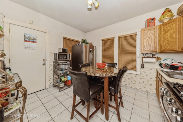 dining space featuring light tile patterned floors