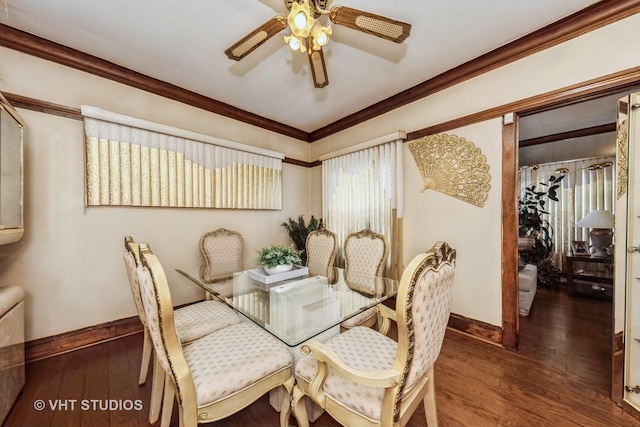 dining room featuring crown molding, baseboards, ceiling fan, and hardwood / wood-style floors