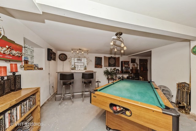 game room featuring a dry bar, billiards, and finished concrete floors