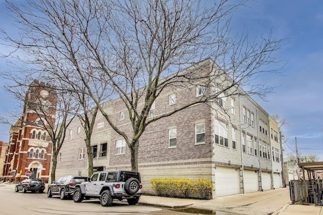 1705 W Le Moyne St Unit G, Chicago, IL 60622 - view of building exterior featuring a garage