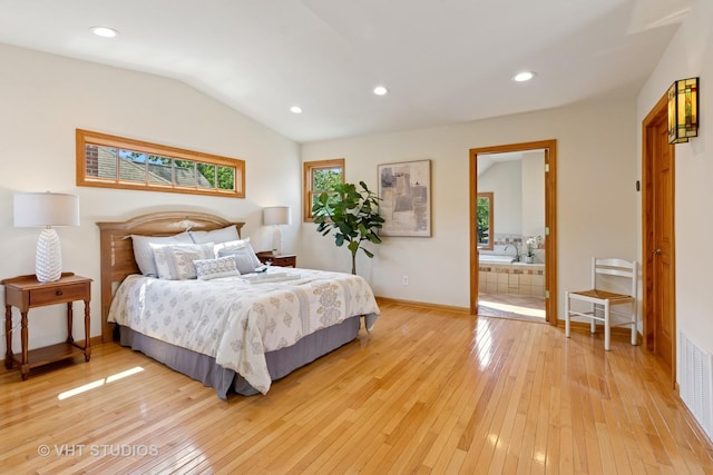 1515 W Glenlake Ave, Chicago, IL 60660 - bedroom with light wood-style flooring, vaulted ceiling, recessed lighting, and ensuite bath