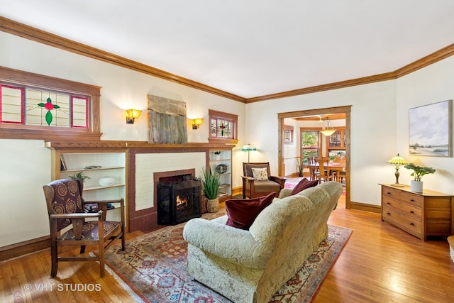 1515 W Glenlake Ave, Chicago, IL 60660 - living room with ornamental molding, wood-type flooring, and a brick fireplace