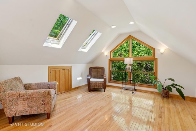 1515 W Glenlake Ave, Chicago, IL 60660 - sitting room with light wood-style flooring, lofted ceiling, a skylight, and recessed lighting