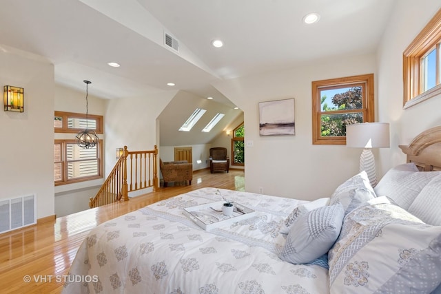 1515 W Glenlake Ave, Chicago, IL 60660 - bedroom featuring vaulted ceiling, wood finished floors, recessed lighting, and a chandelier
