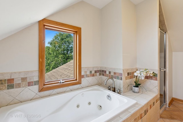 1515 W Glenlake Ave, Chicago, IL 60660 - full bath featuring a tub with jets, lofted ceiling, a shower stall, and tile patterned floors
