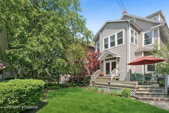 1515 W Glenlake Ave, Chicago, IL 60660 - rear view of house with a deck, a lawn, and french doors