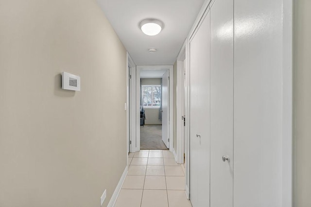 218 Oak Knoll Ct Unit D1, Schaumburg, IL 60193 - corridor with baseboards and light tile patterned floors