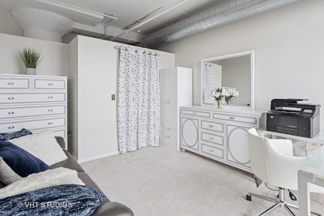 office area featuring light carpet