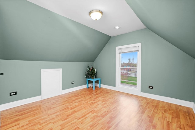 3024 E Ave, Berwyn, IL 60402 - bonus room with lofted ceiling, wood finished floors, and baseboards