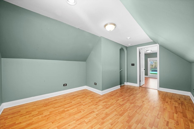 3024 E Ave, Berwyn, IL 60402 - bonus room with baseboards, vaulted ceiling, and wood finished floors