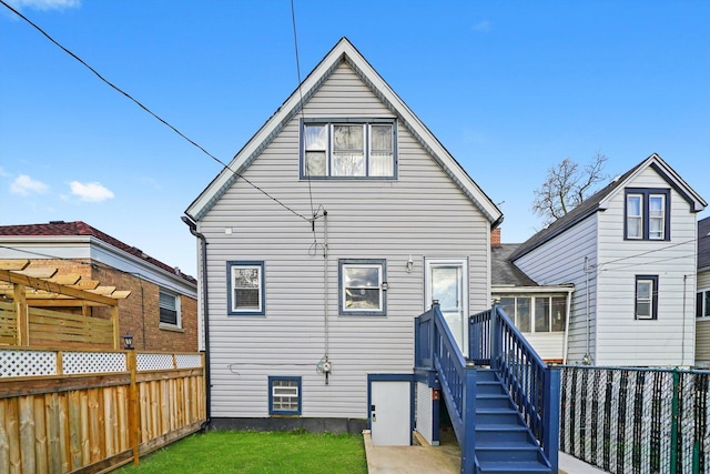 3024 E Ave, Berwyn, IL 60402 - rear view of house featuring a lawn and a fenced backyard