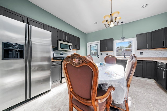 3024 E Ave, Berwyn, IL 60402 - dining space featuring an inviting chandelier and light tile patterned floors