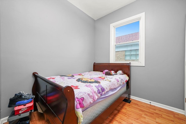 3024 E Ave, Berwyn, IL 60402 - bedroom with baseboards and wood finished floors