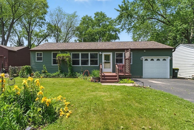 1609 Meadow Ln, Mchenry, IL 60050 - single story home featuring asphalt driveway, an attached garage, a front lawn, and a shingled roof