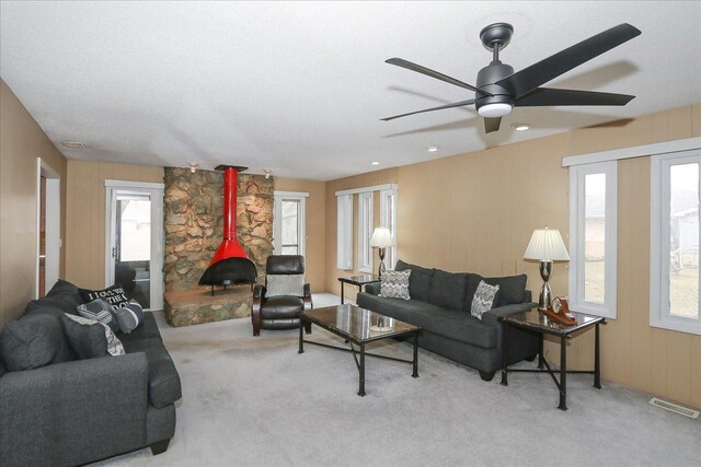 living room featuring visible vents, carpet, and plenty of natural light