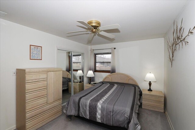 bedroom with carpet, ceiling fan, baseboards, and a closet