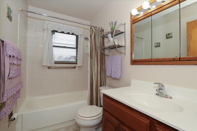 full bath featuring shower / bath combination with curtain, toilet, and vanity