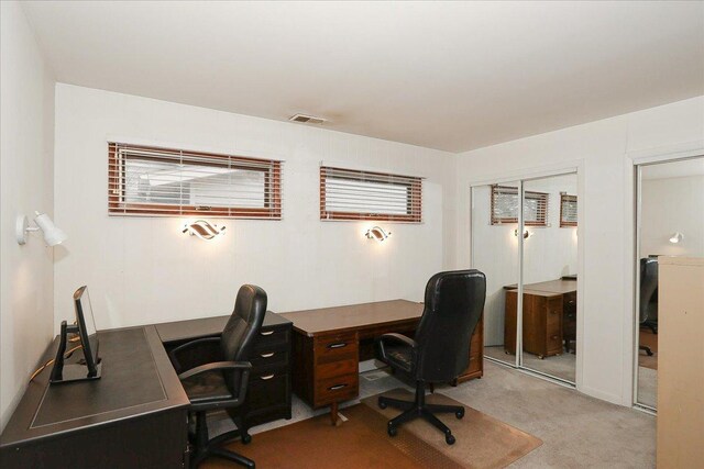 office space with carpet and visible vents