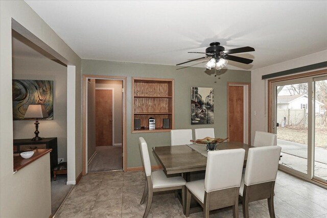 dining space with ceiling fan