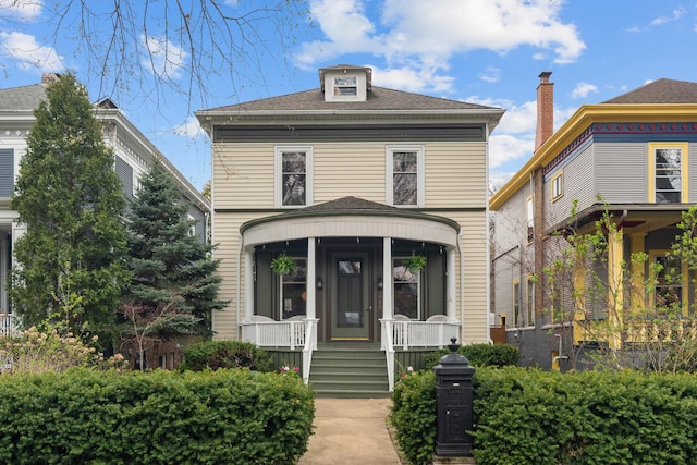 1942 Orrington Ave, Evanston, IL 60201 - traditional style home featuring a porch and roof with shingles