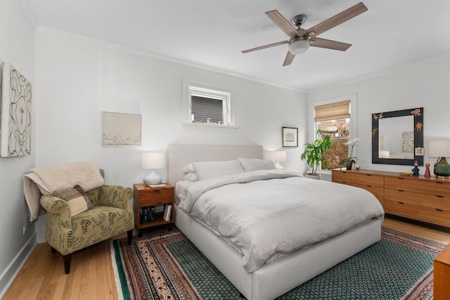1942 Orrington Ave, Evanston, IL 60201 - bedroom with wood finished floors, ceiling fan, crown molding, and baseboards