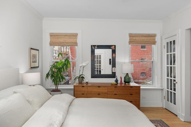 1942 Orrington Ave, Evanston, IL 60201 - bedroom featuring baseboards, ornamental molding, and light wood-style flooring