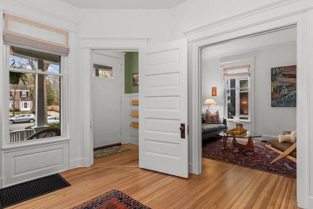 1942 Orrington Ave, Evanston, IL 60201 - interior space featuring visible vents, ornamental molding, and light wood finished floors
