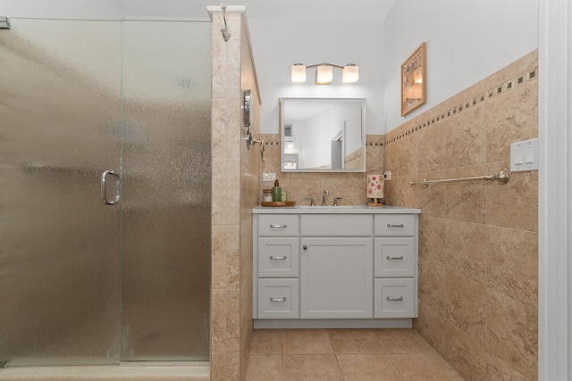 1942 Orrington Ave, Evanston, IL 60201 - full bath with tile walls, a stall shower, tile patterned floors, and vanity