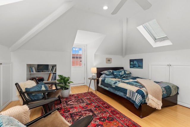 1942 Orrington Ave, Evanston, IL 60201 - bedroom featuring wood finished floors, ceiling fan, and vaulted ceiling with skylight