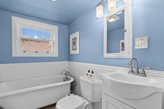 1942 Orrington Ave, Evanston, IL 60201 - full bath with toilet, a freestanding bath, wainscoting, and vanity