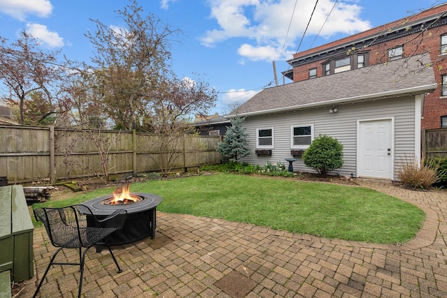 1942 Orrington Ave, Evanston, IL 60201 - exterior space with an outdoor fire pit, a patio area, a fenced backyard, and a lawn