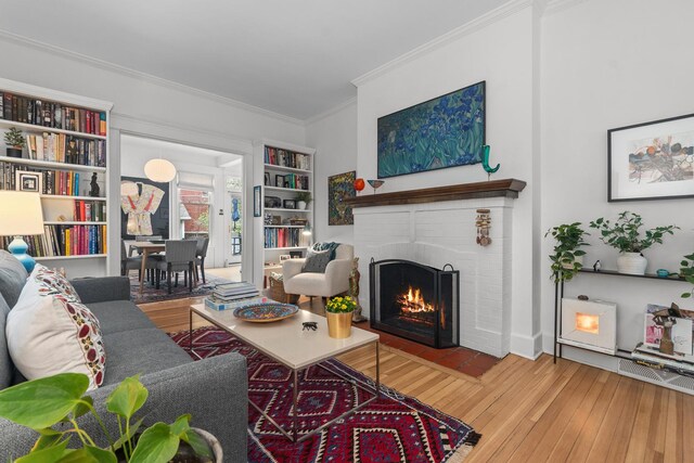 1942 Orrington Ave, Evanston, IL 60201 - living area with hardwood / wood-style floors, ornamental molding, and a brick fireplace