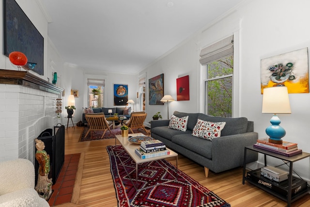 1942 Orrington Ave, Evanston, IL 60201 - living area with a fireplace, light wood-type flooring, and ornamental molding