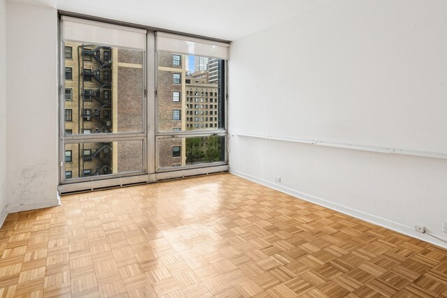 880 N Lake Shore Dr Unit 6G, Chicago, IL 60611 - unfurnished room featuring baseboards and floor to ceiling windows