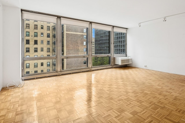 880 N Lake Shore Dr Unit 6G, Chicago, IL 60611 - spare room with floor to ceiling windows and a wall mounted air conditioner