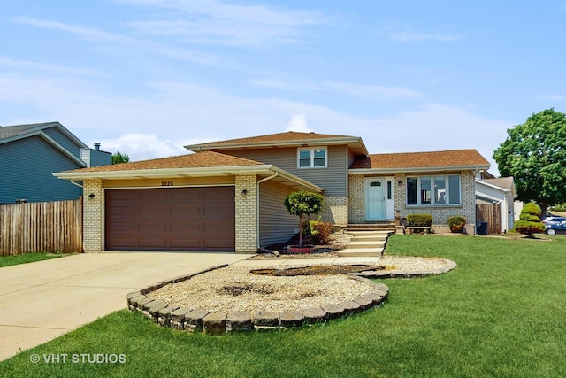 2220 Manico Dr, Crest Hill, IL 60403 - split level home featuring brick siding, an attached garage, concrete driveway, and a chimney
