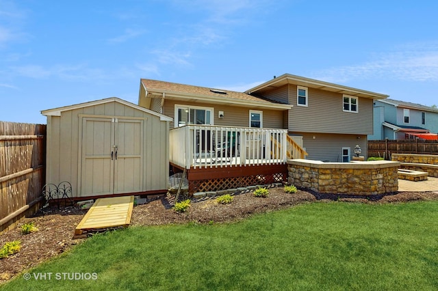 2220 Manico Dr, Crest Hill, IL 60403 - back of property featuring a deck, a storage shed, a fenced backyard, and roof with shingles