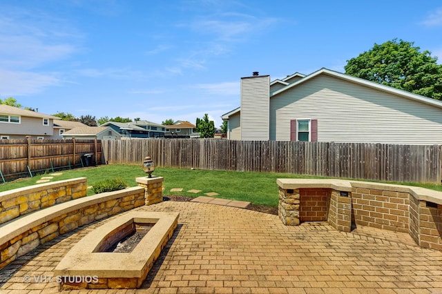 2220 Manico Dr, Crest Hill, IL 60403 - fenced backyard with an outdoor fire pit and a patio area