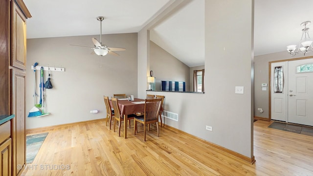 2220 Manico Dr, Crest Hill, IL 60403 - dining space with light wood finished floors, a ceiling fan, a chandelier, and lofted ceiling