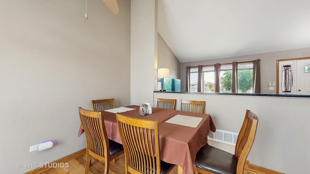 2220 Manico Dr, Crest Hill, IL 60403 - dining area featuring lofted ceiling and wood finished floors