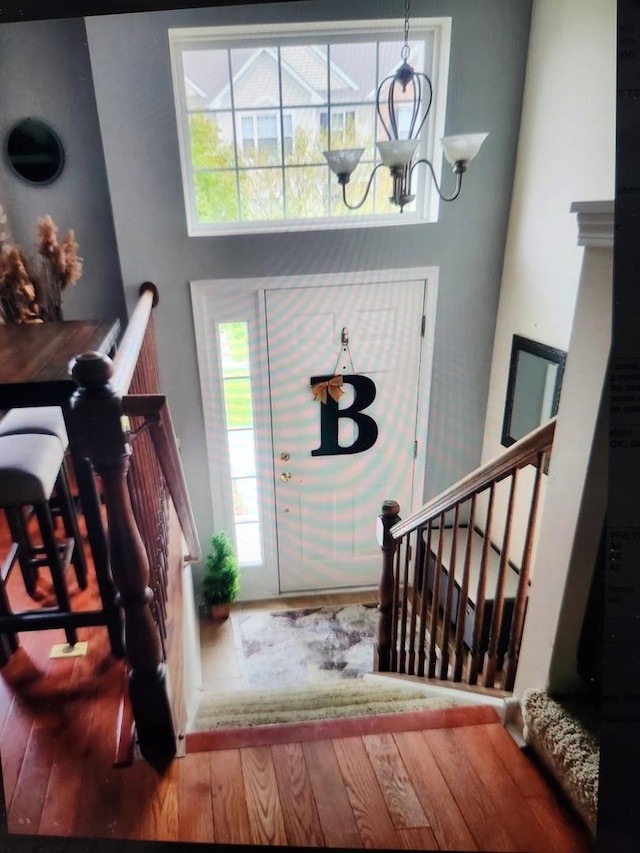 24622 George Washington Dr, Plainfield, IL 60544 - entrance foyer with a chandelier, stairs, and wood finished floors