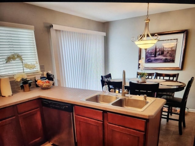 24622 George Washington Dr, Plainfield, IL 60544 - kitchen featuring dishwasher, decorative light fixtures, light countertops, reddish brown cabinets, and tile patterned floors