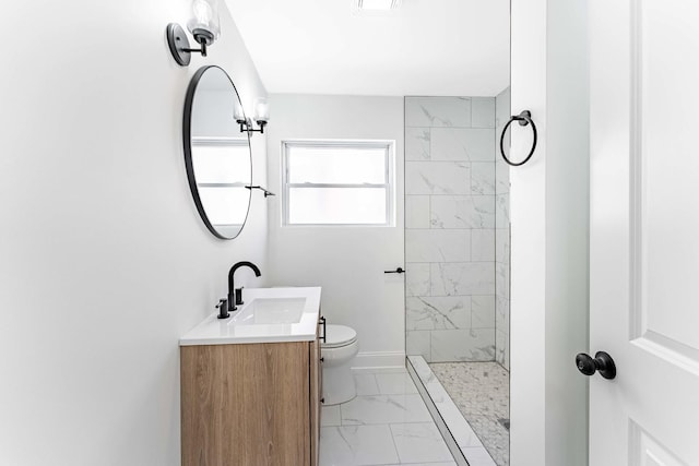 full bath with a tile shower, toilet, baseboards, marble finish floor, and vanity