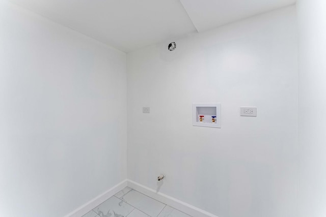 washroom featuring washer hookup, baseboards, and laundry area