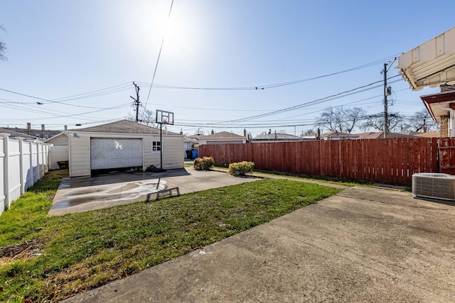 view of yard with a fenced backyard, an outbuilding, a patio area, and cooling unit