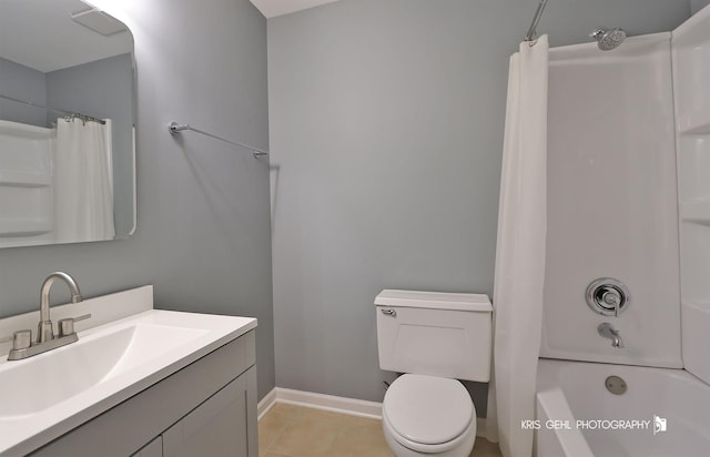 full bath with baseboards, toilet, vanity, shower / bath combo with shower curtain, and tile patterned floors